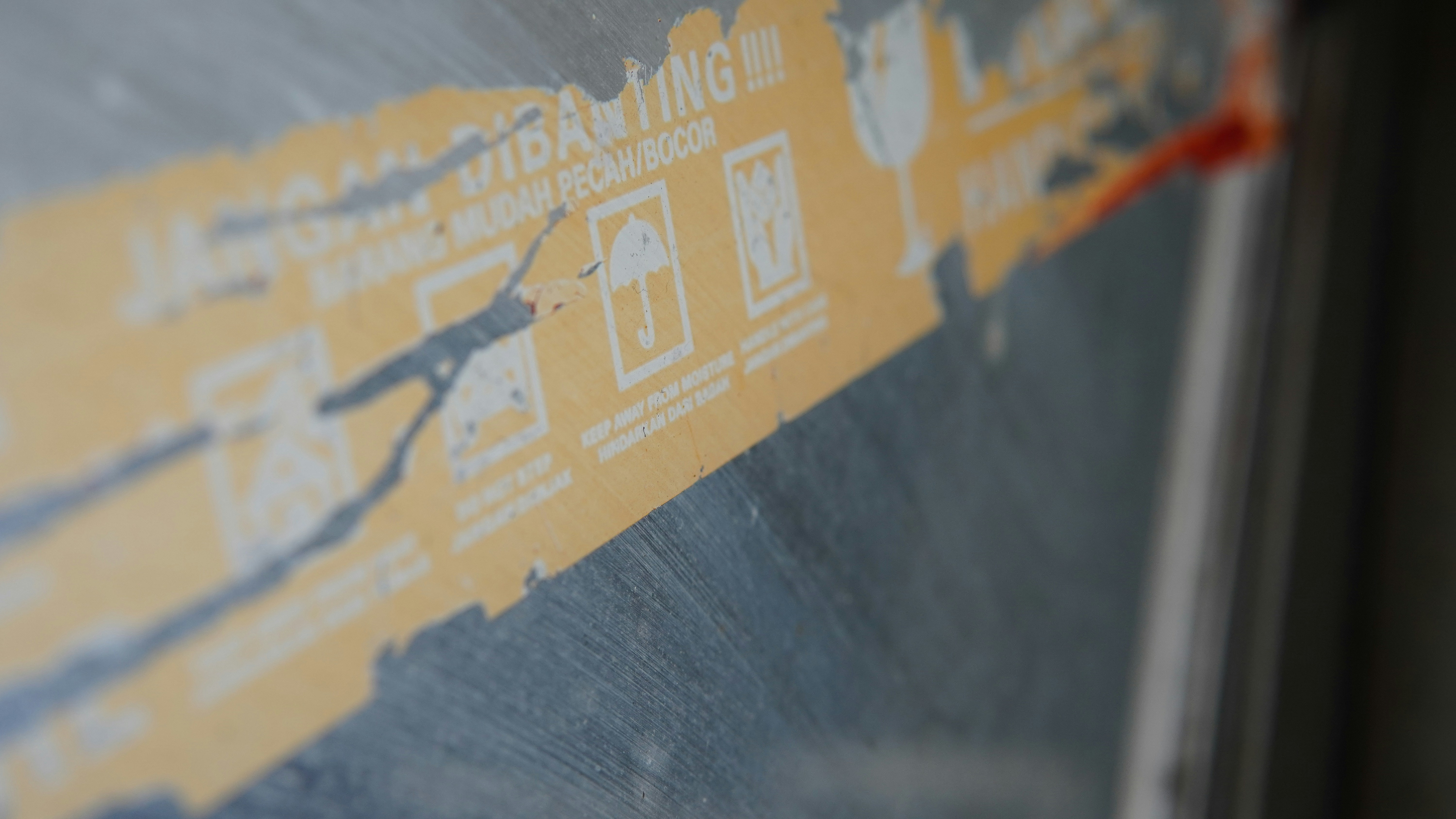 A close up of a yellow and blue sign