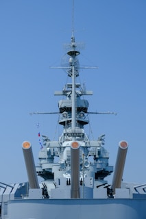 A large blue ship in the middle of a body of water