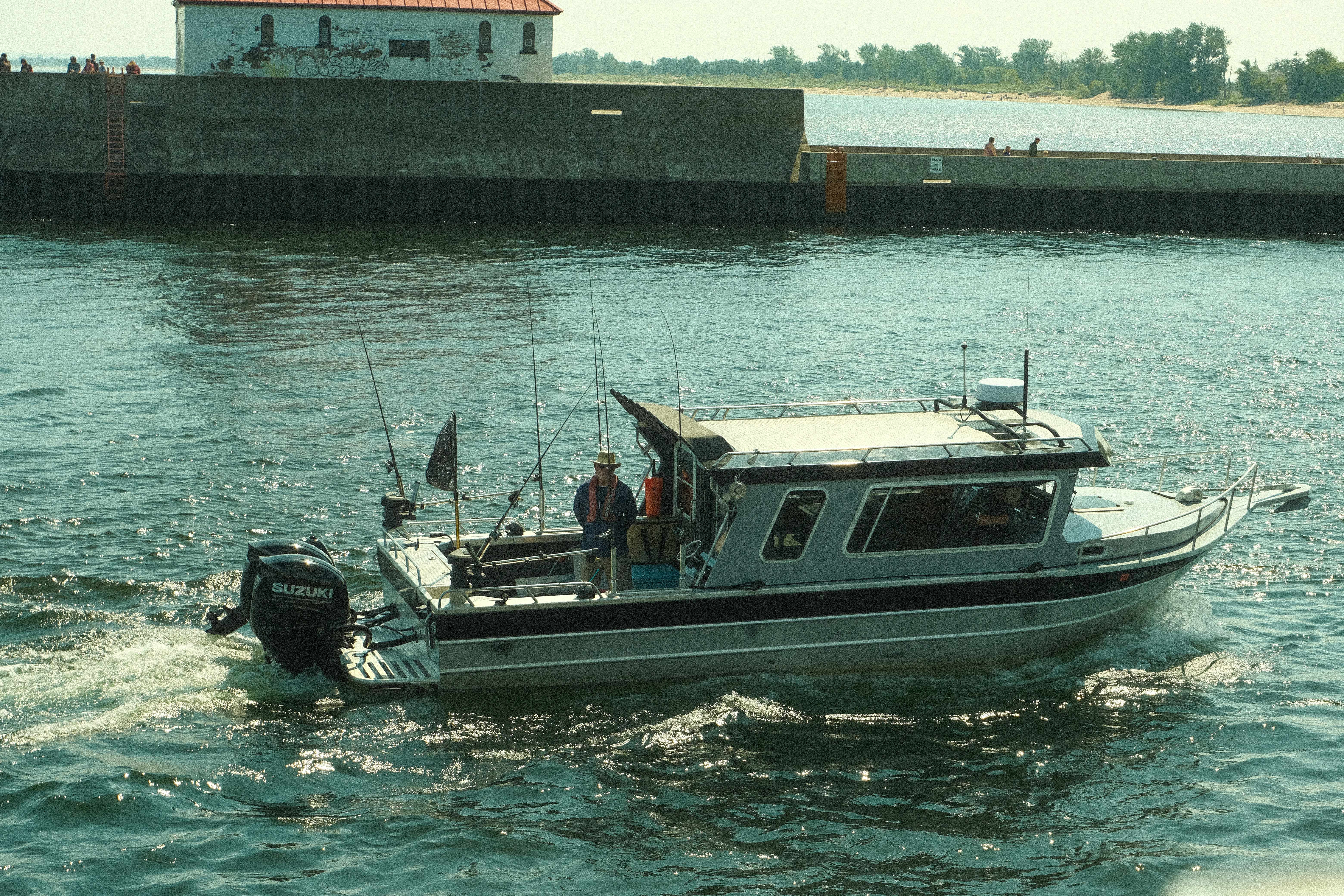 A group of people riding on the back of a boat