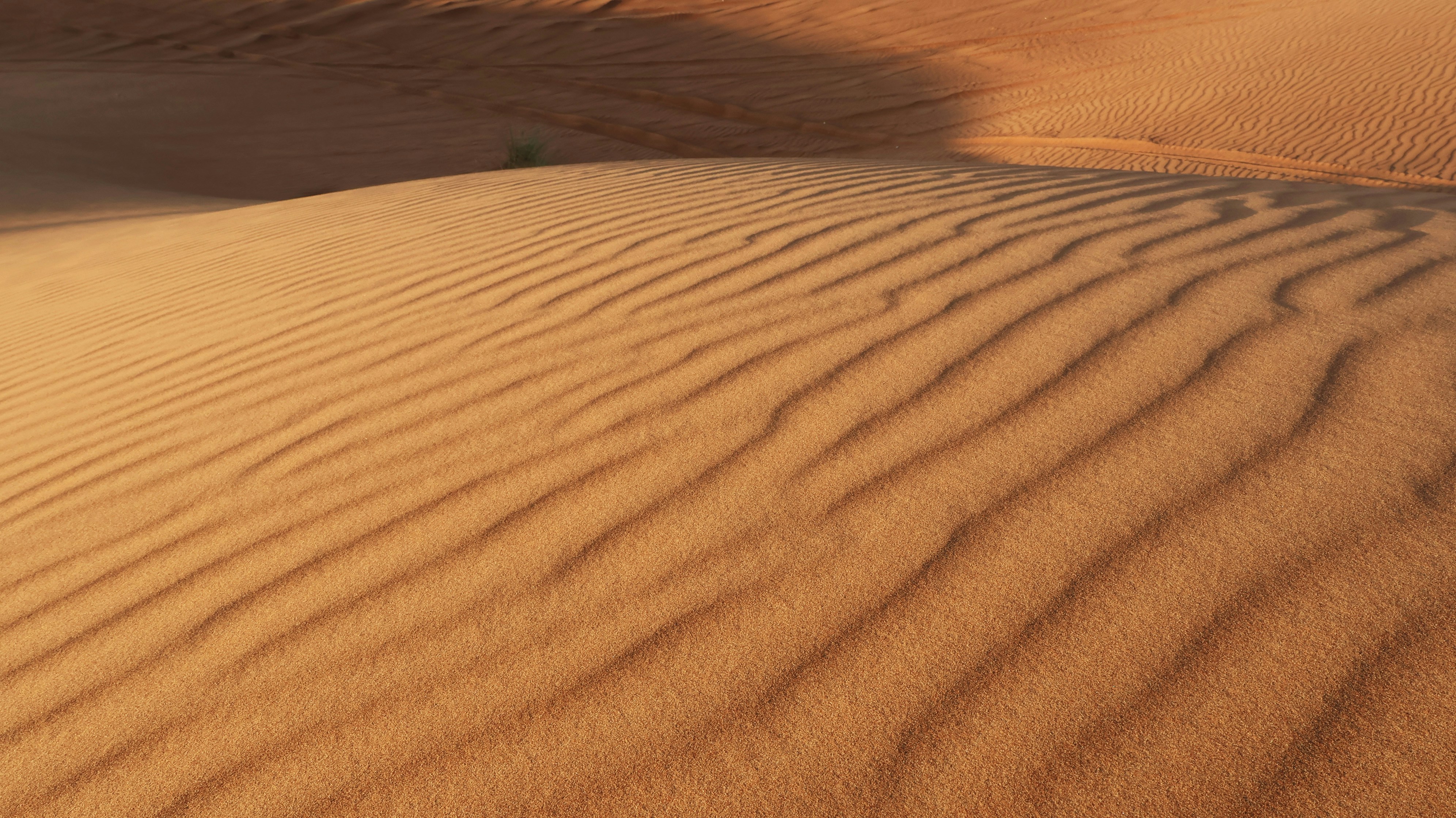 A large sand dune in the middle of a desert