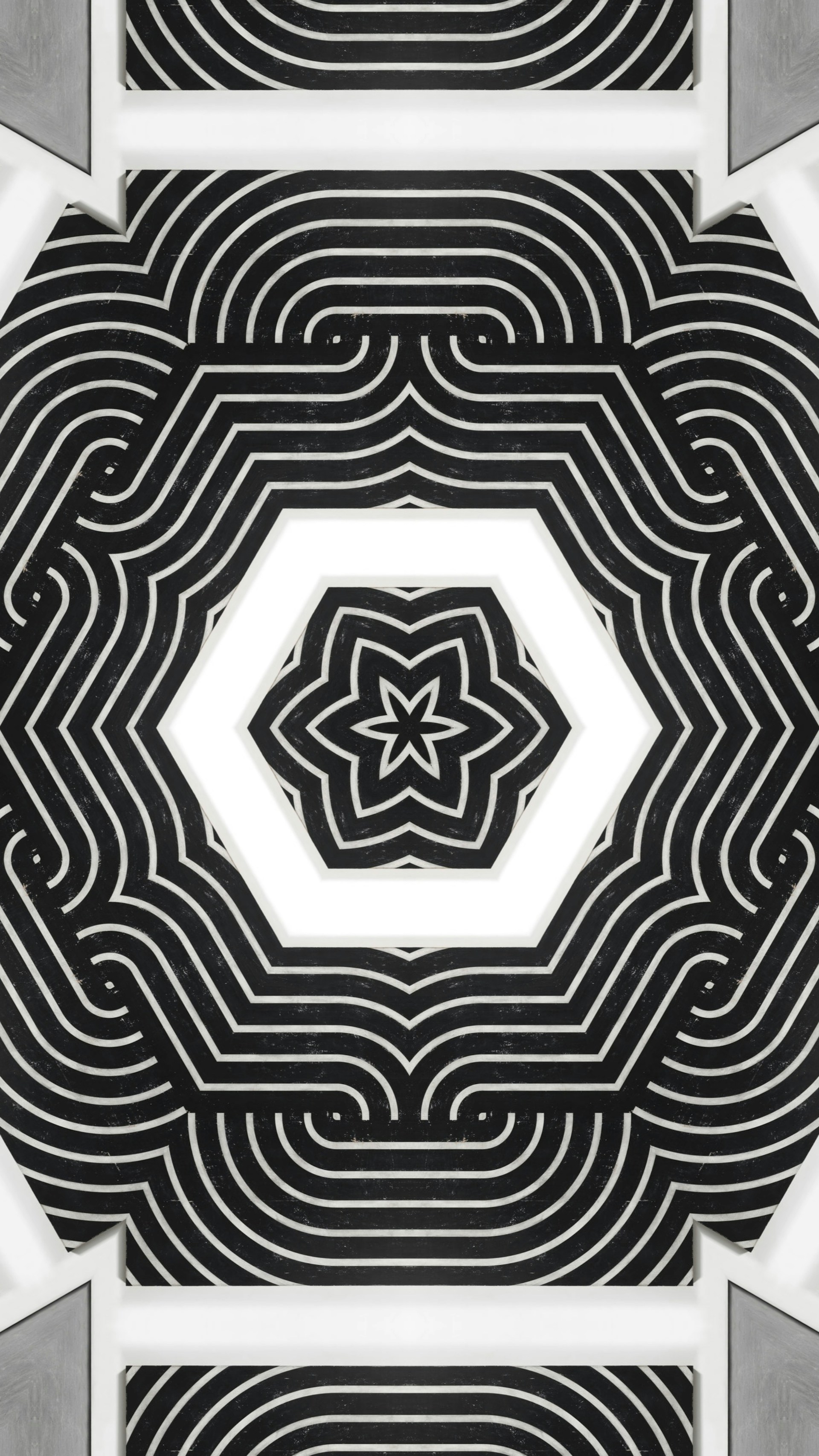A black and white photo with a star in the center
