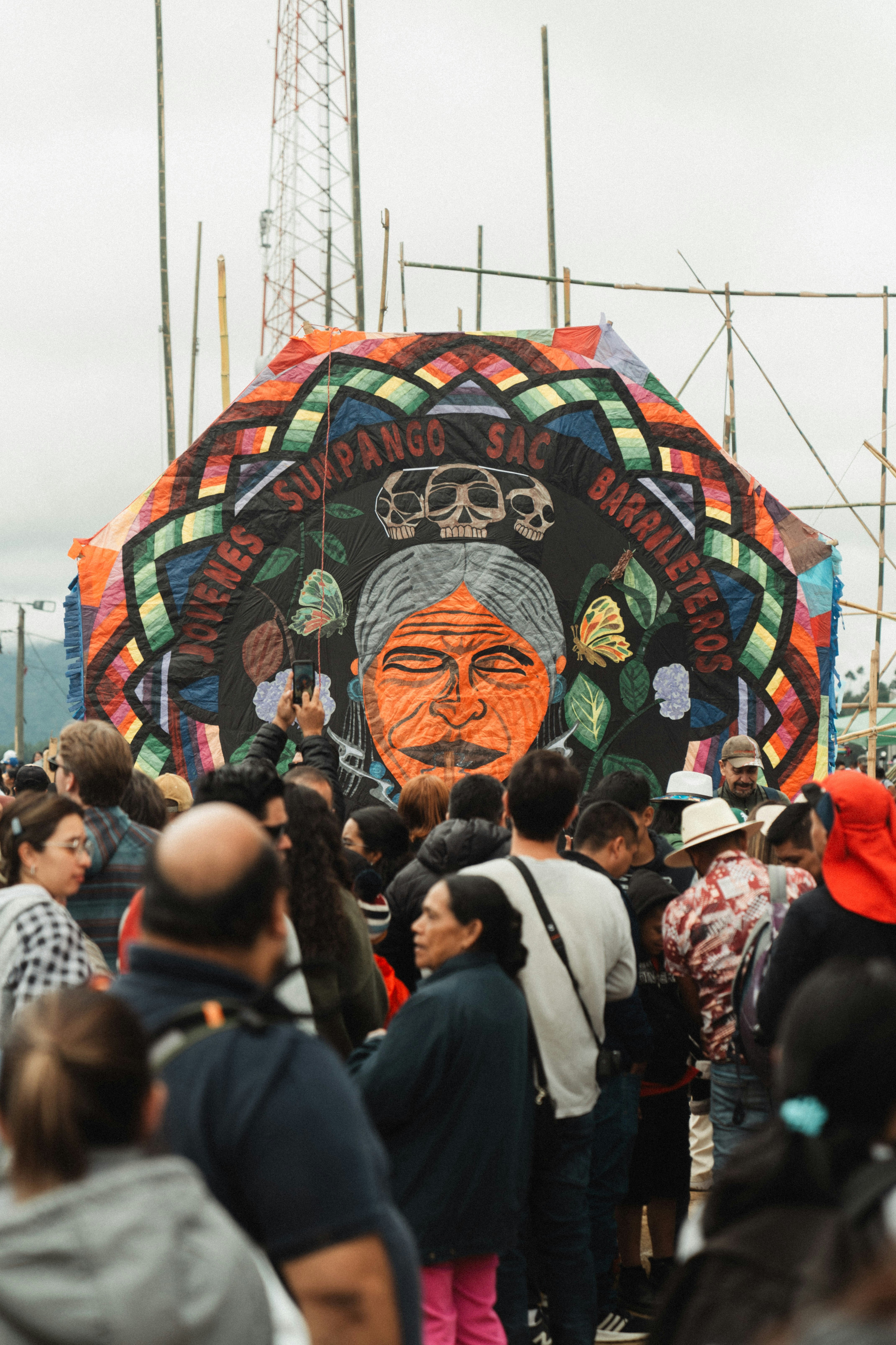 A crowd of people standing around a giant sign photo – Free Woman Image ...