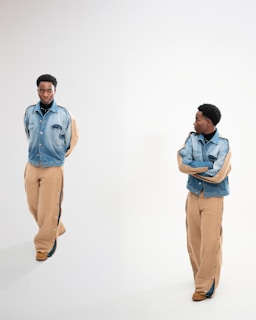 A man in a blue shirt and tan pants