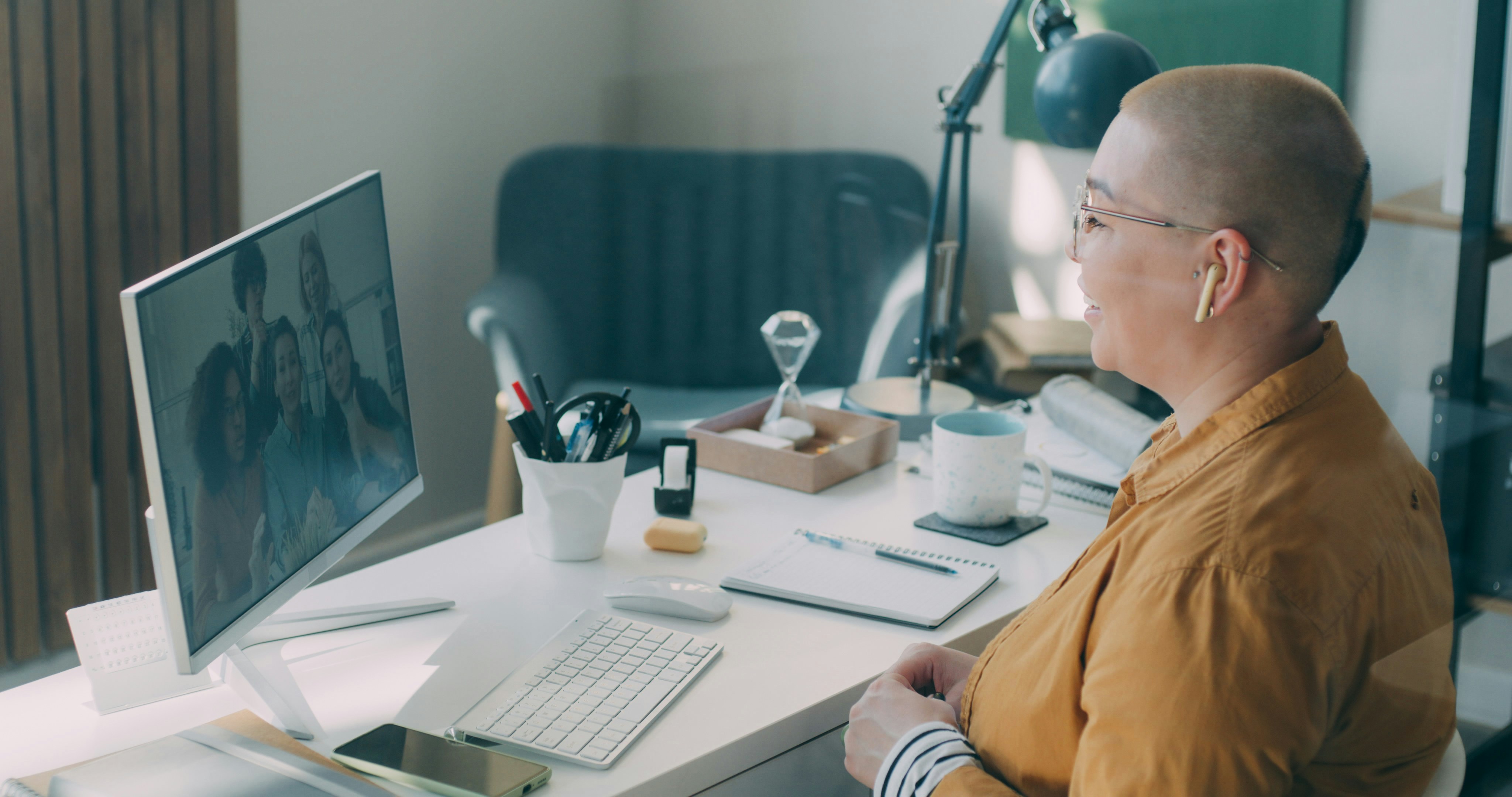 A man sitting at a desk with a computer