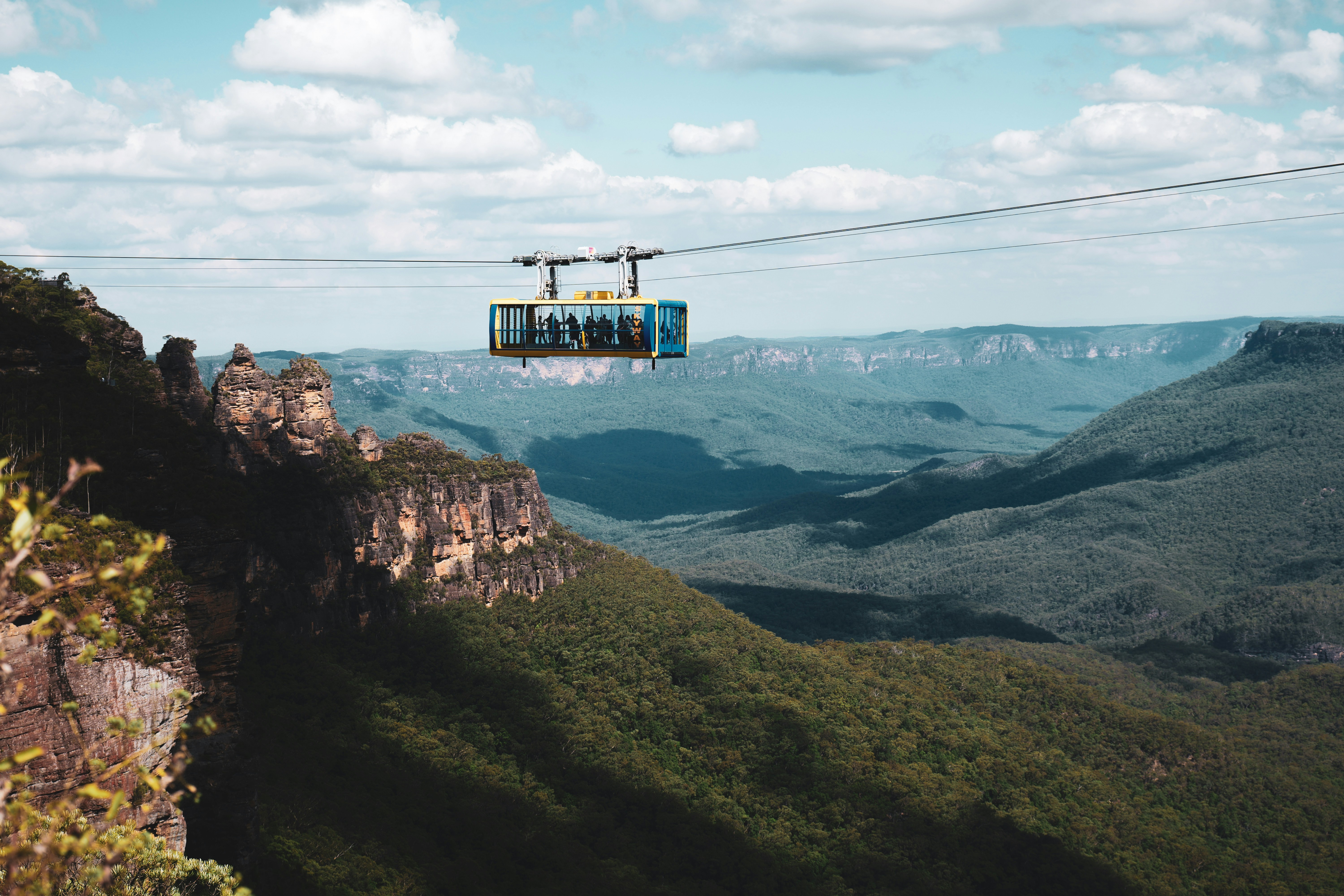 A cable car going over a mountain range