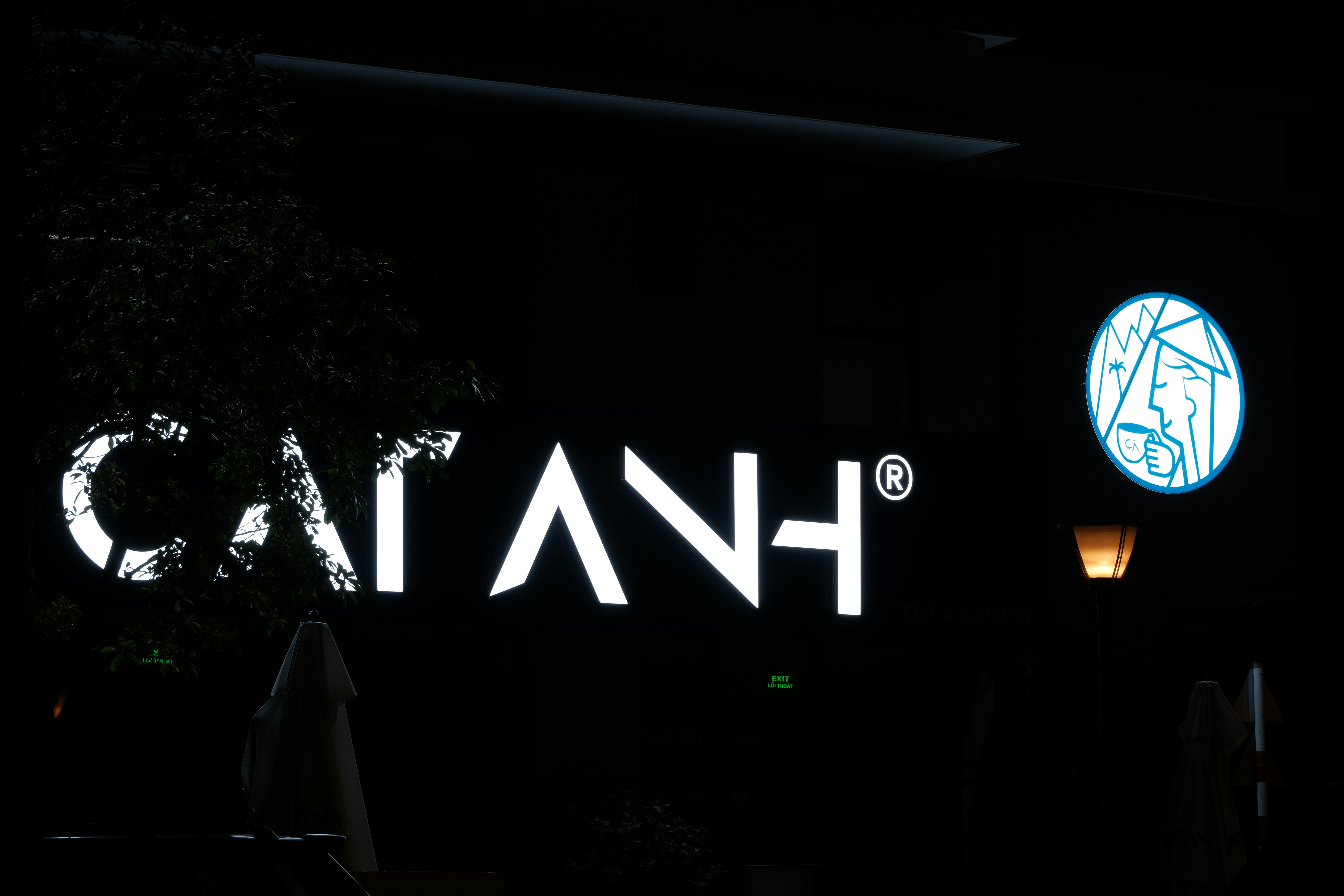 A sign that reads cia in a dark room