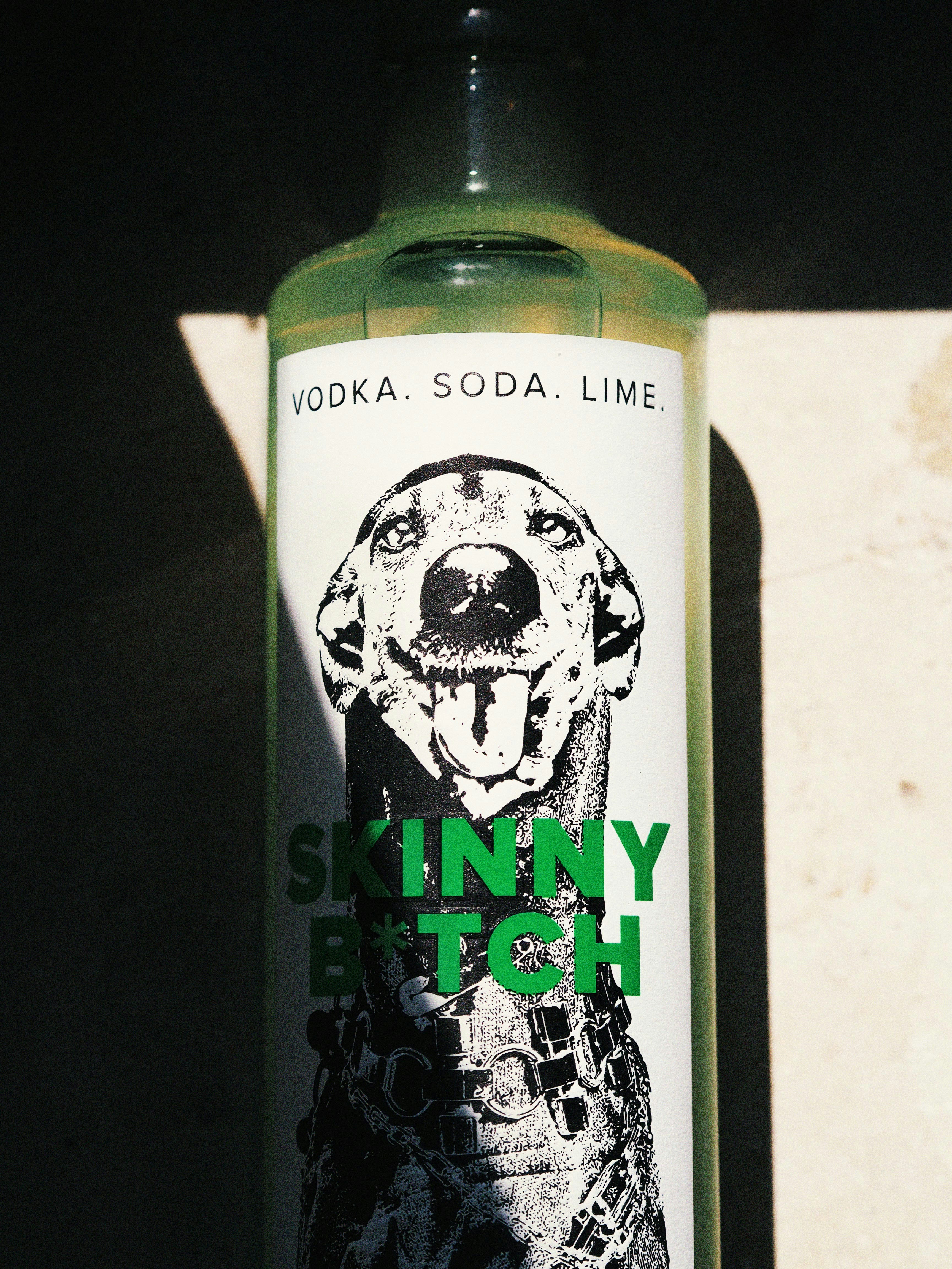 A bottle of vodka with a dog on it