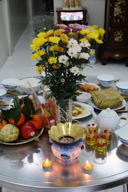 A table topped with plates and bowls filled with food