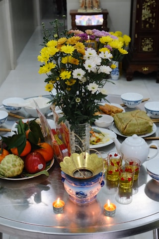 A table topped with plates and bowls filled with food