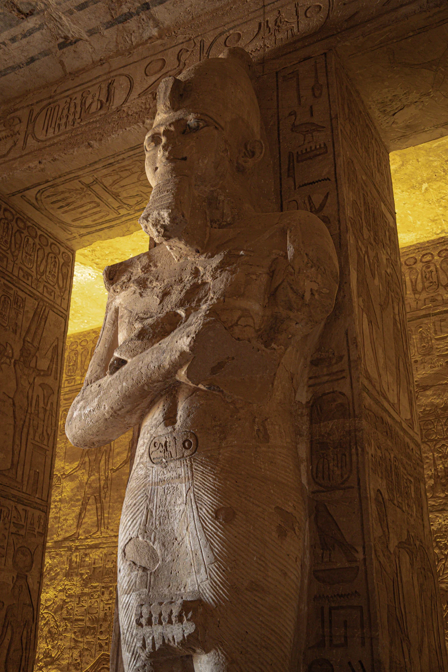 A statue of an ancient deity displayed in a museum