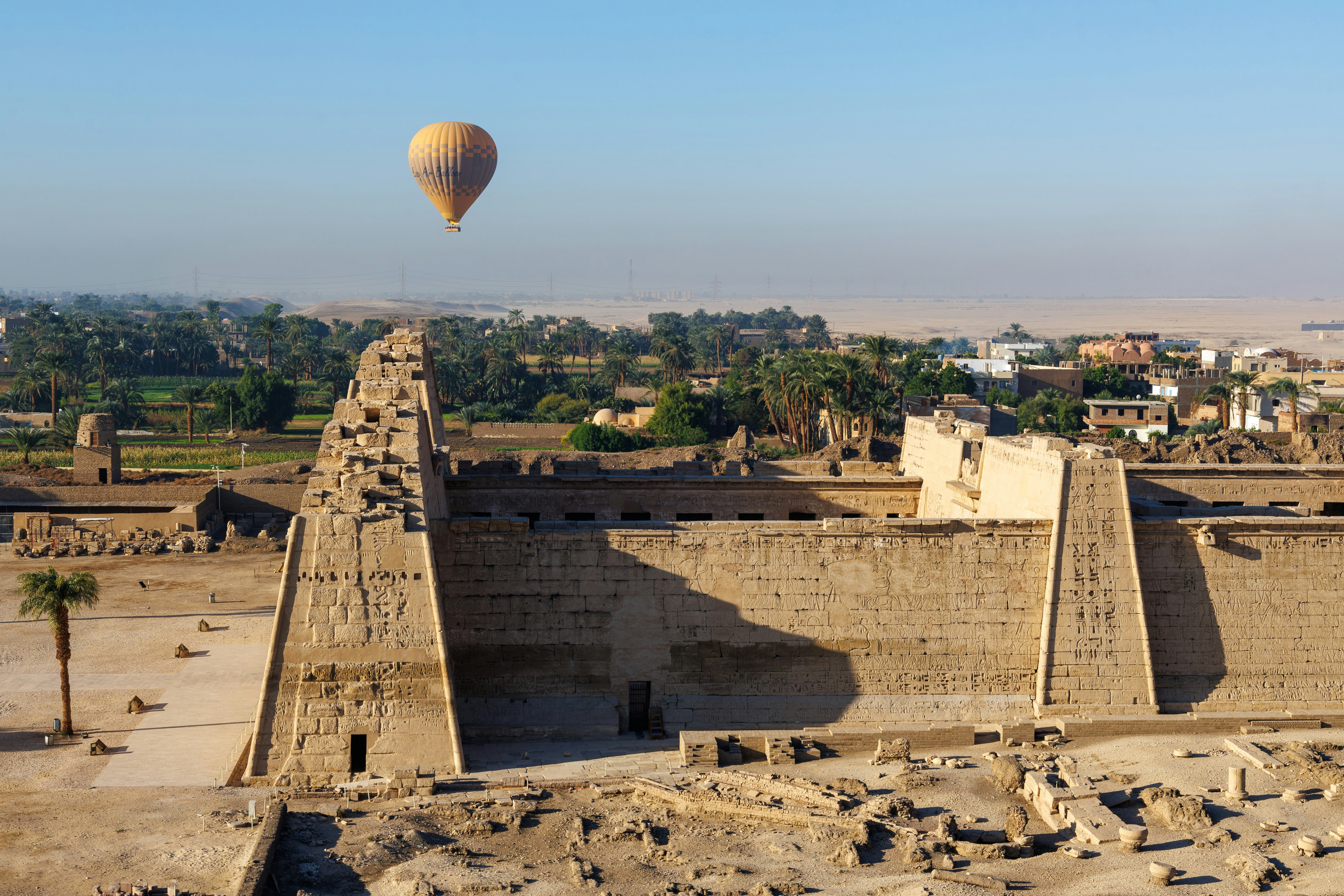 A hot air balloon flying over a city