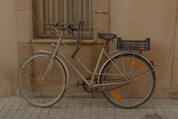 A bicycle parked on the side of a building