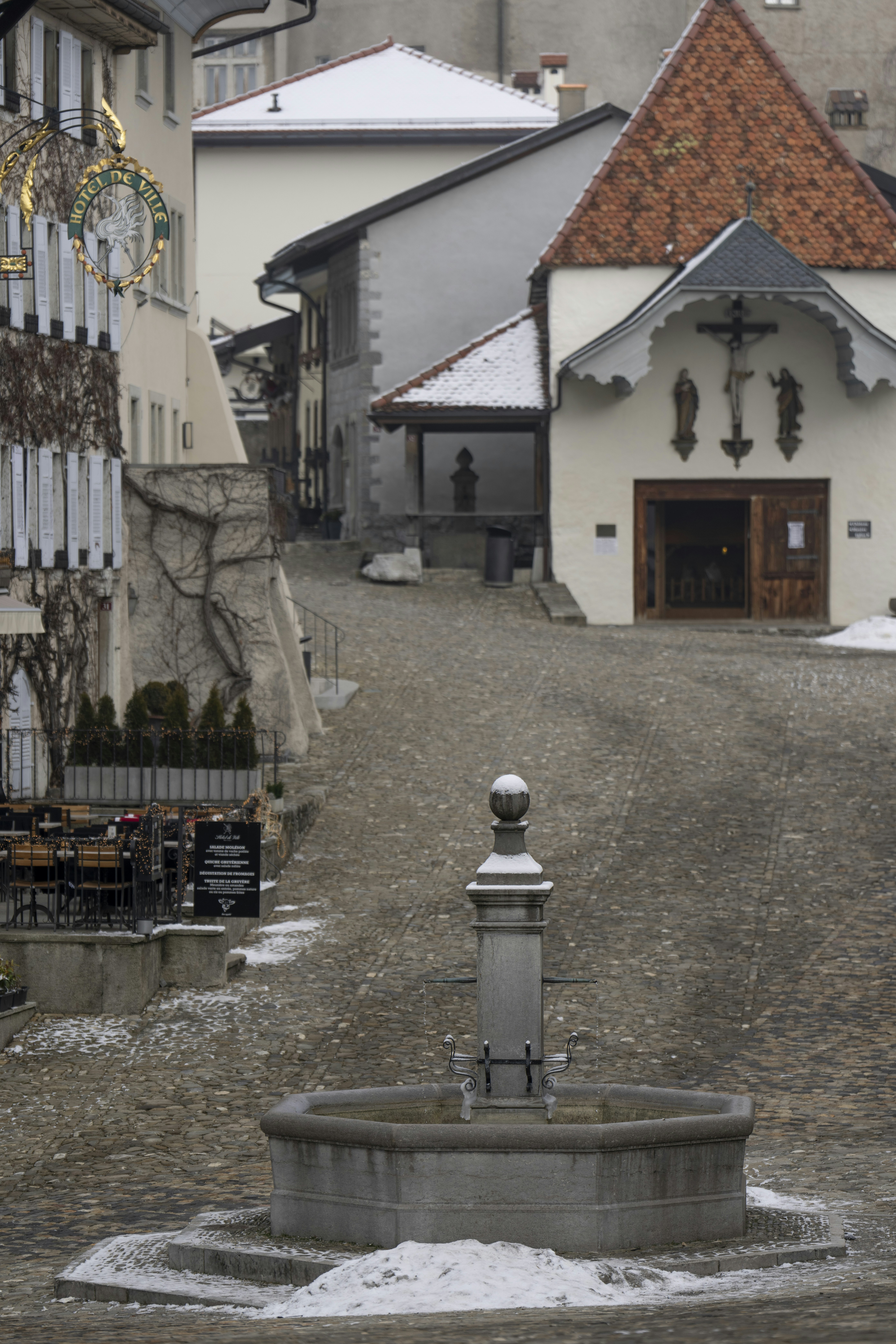 A street with a fountain in the middle of it