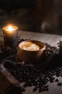 A couple of candles sitting on top of a table
