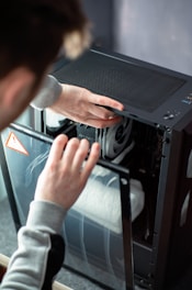 A person is working on a computer in a room