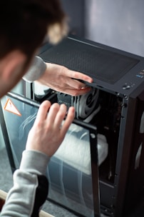A person is working on a computer in a room