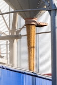 A grain dispenser in front of a building