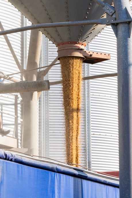 A grain dispenser in front of a building