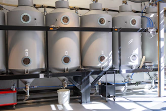 A bunch of tanks are lined up in a room