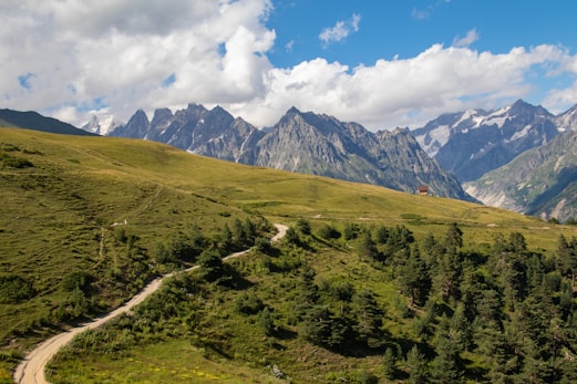 A scenic view of a road winding through the mountains