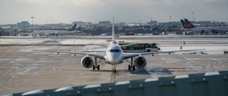 An airplane is parked on the tarmac at an airport