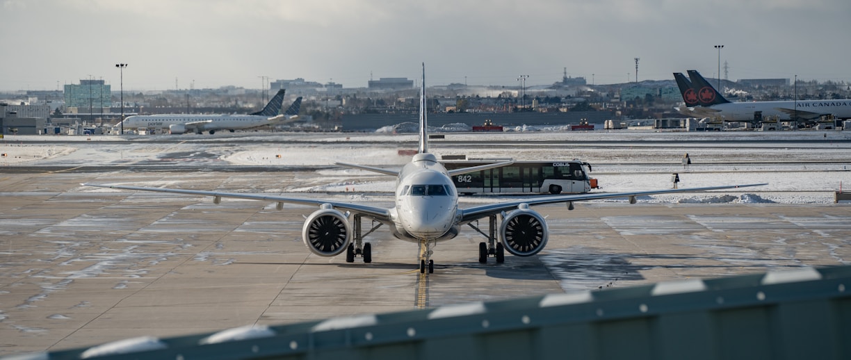 An airplane is parked on the tarmac at an airport