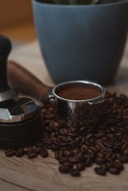 A cup of coffee sitting on top of a wooden table