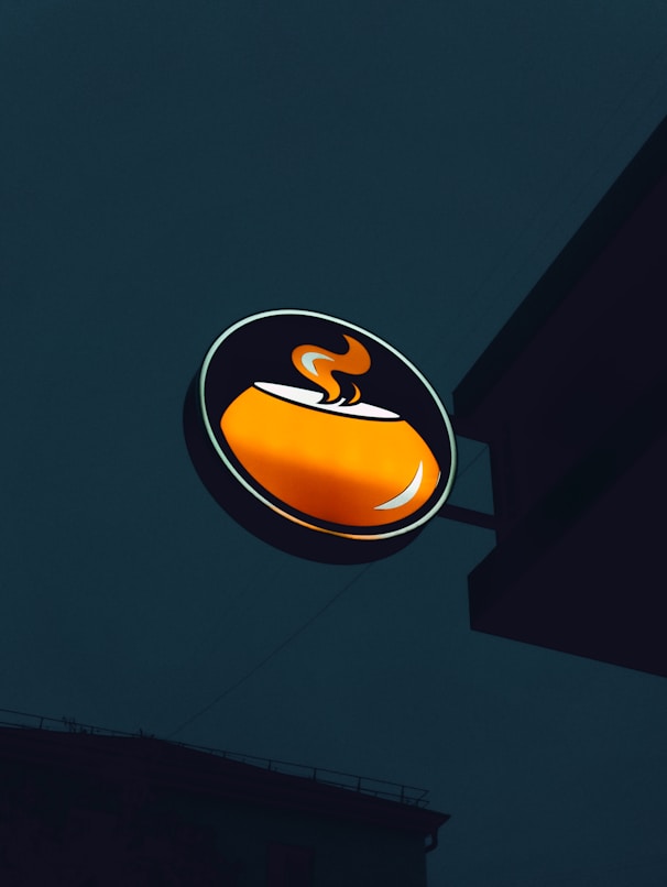 A logo of a coffee shop on a building