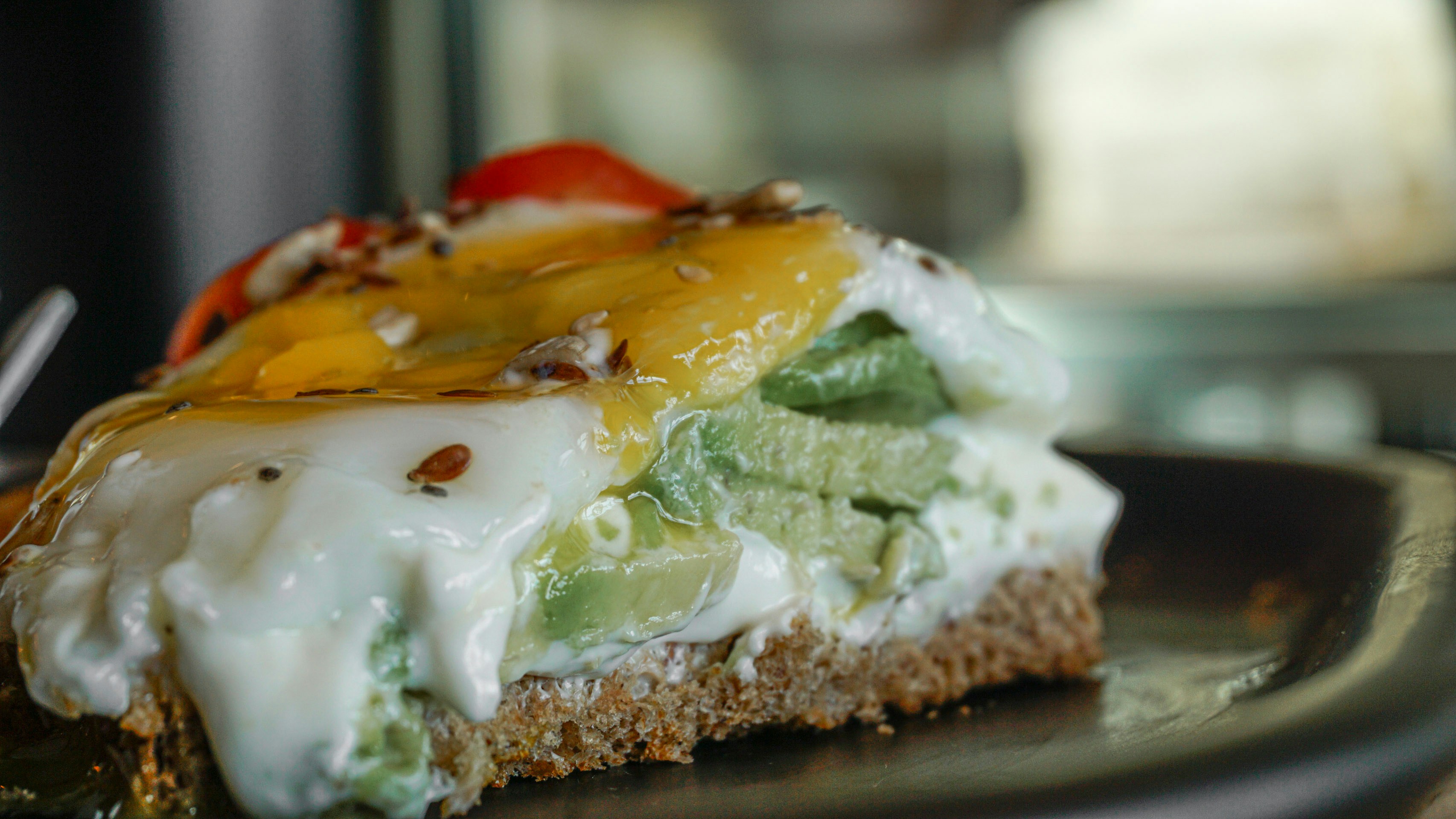 A piece of food on a plate with a fork
