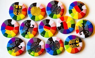 A white plate topped with lots of colorful buttons