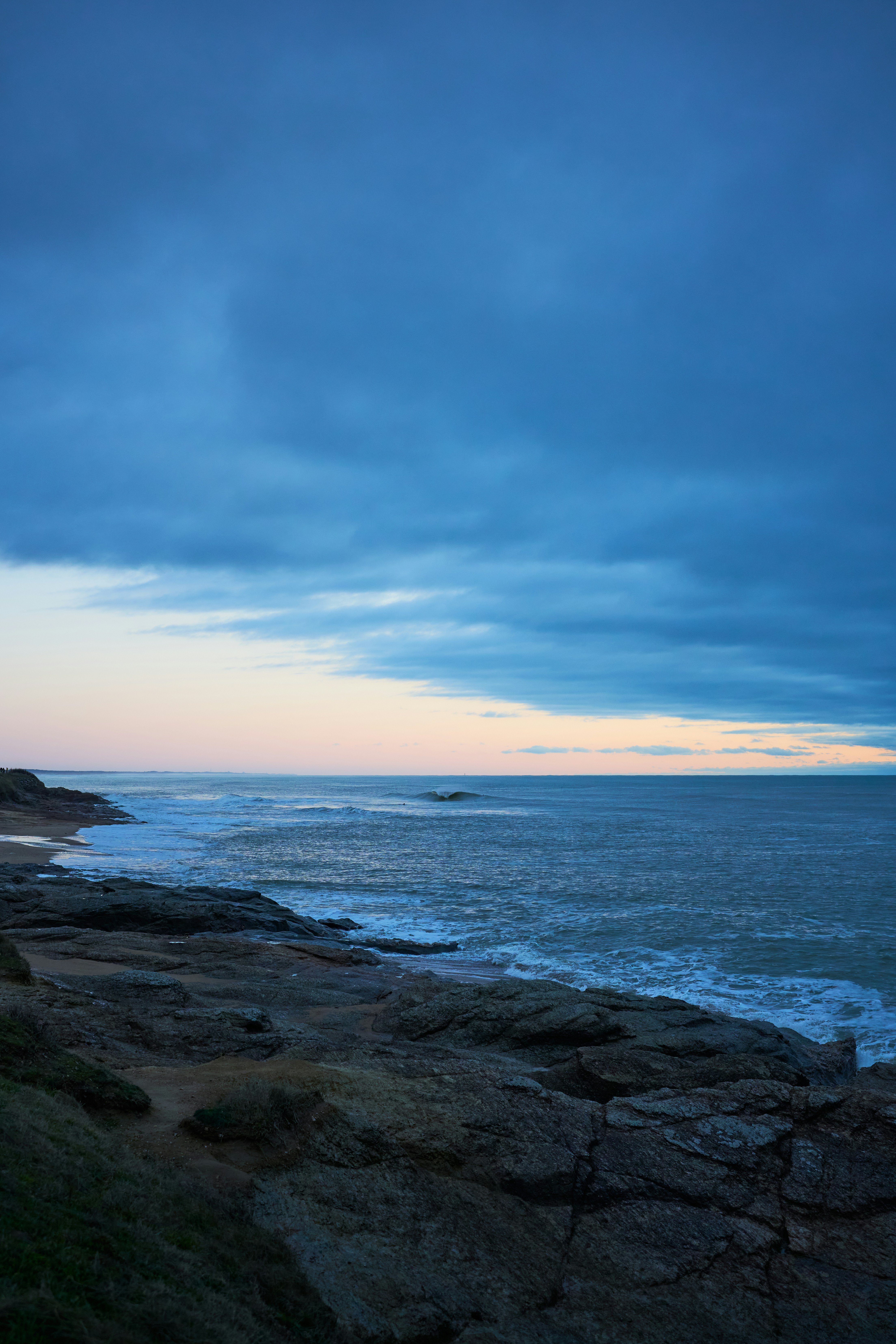 A view of the ocean from a rocky shore