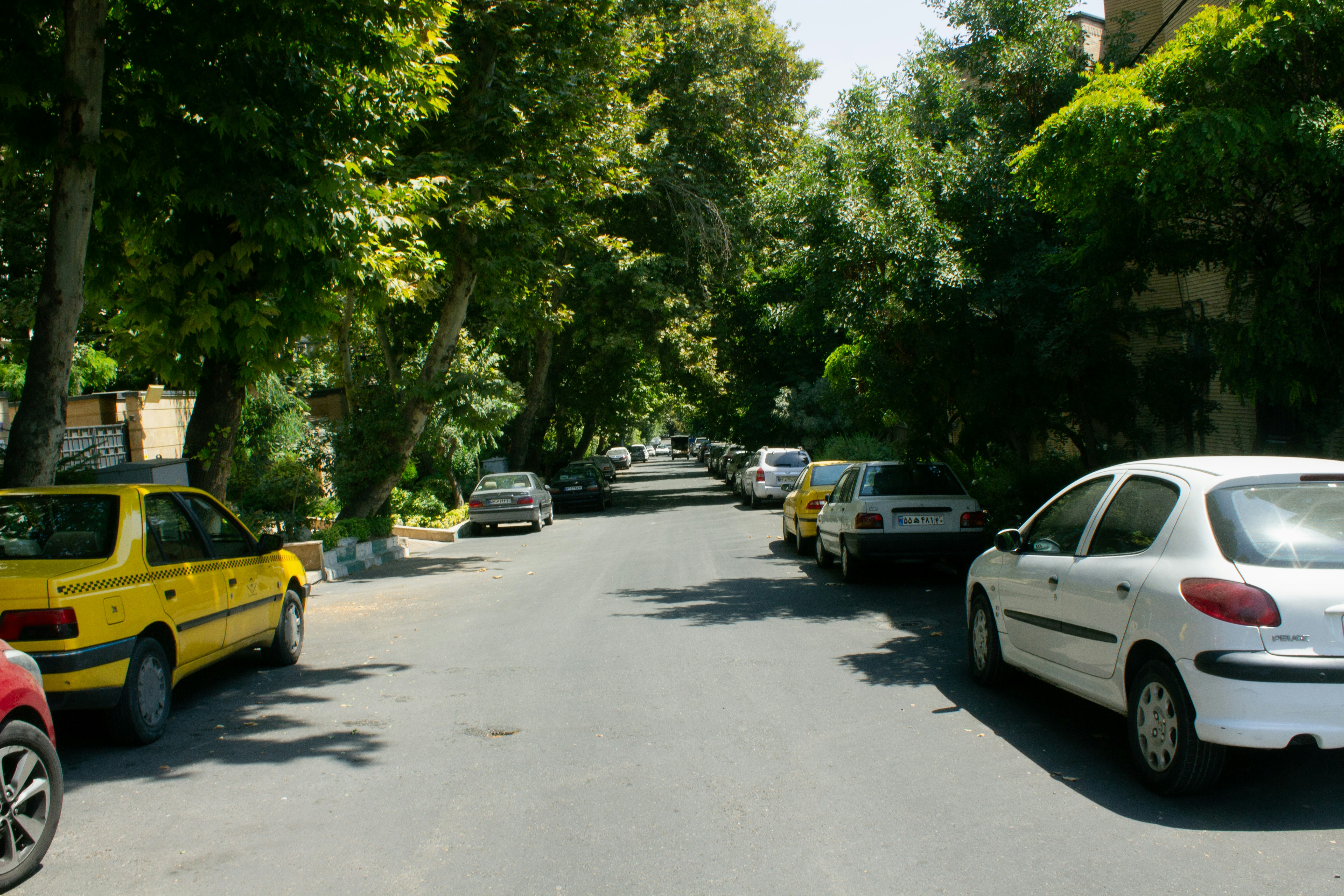 A street filled with lots of parked cars