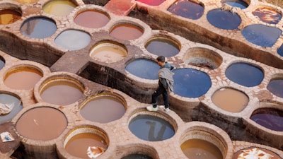 A person standing in front of a box of paint