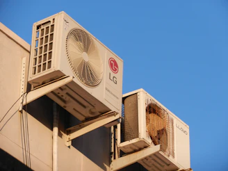 A large air conditioner mounted on the side of a building