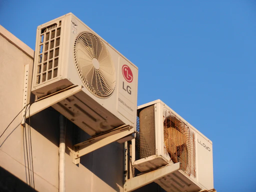 A large air conditioner mounted on the side of a building