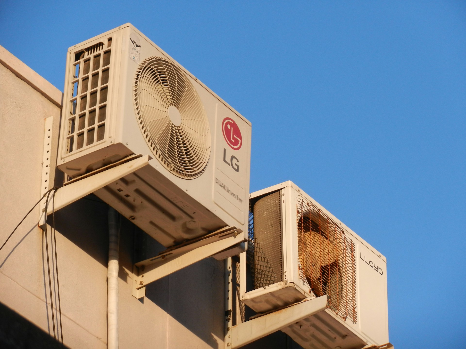 A large air conditioner mounted on the side of a building