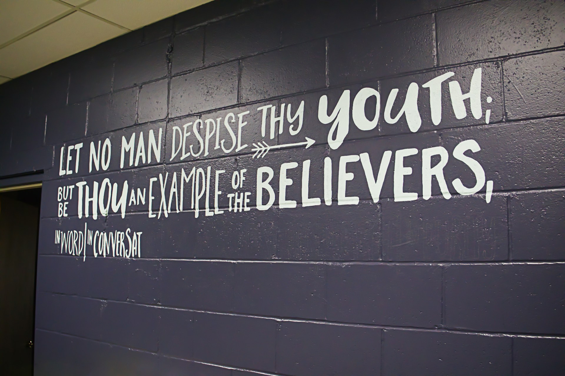 A wall that has some writing on it