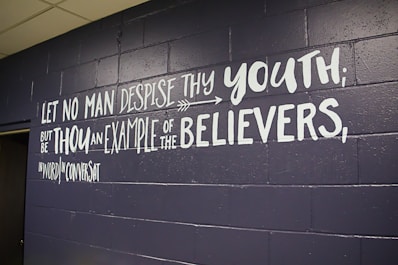 A wall that has some writing on it