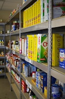 A shelf in a store filled with lots of food