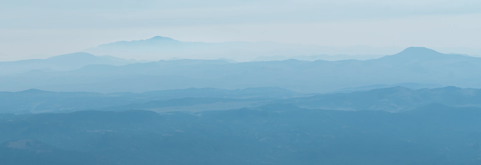 A blurry photo of a mountain range in the distance