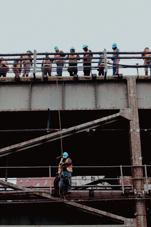 A group of people standing on top of a bridge