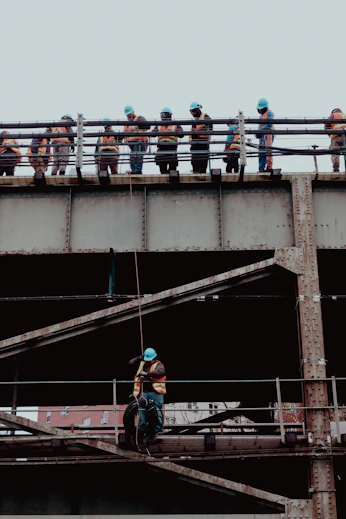 A group of people standing on top of a bridge