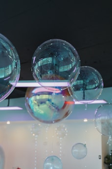 A bunch of bubbles hanging from a ceiling