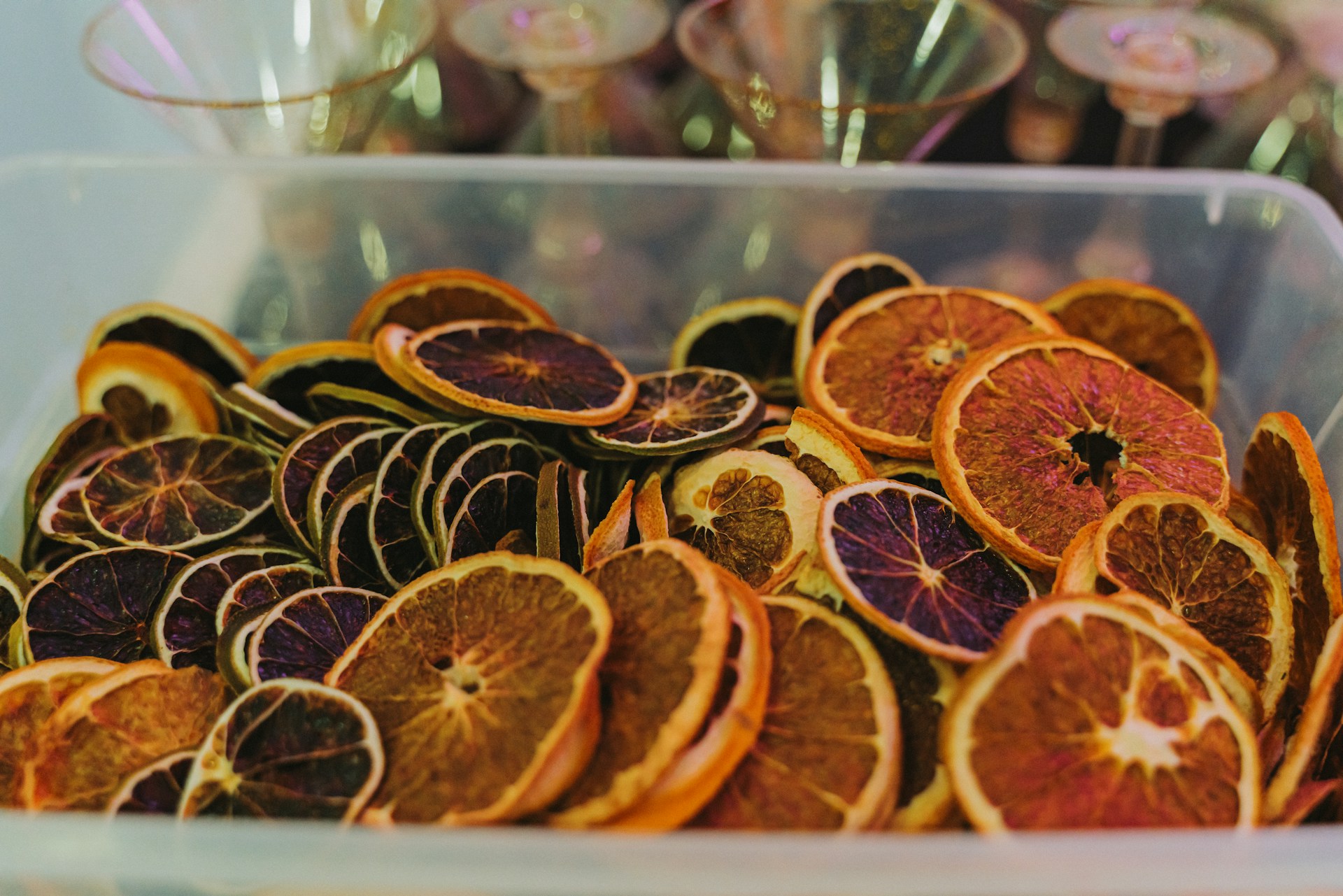 A plastic container filled with orange slices