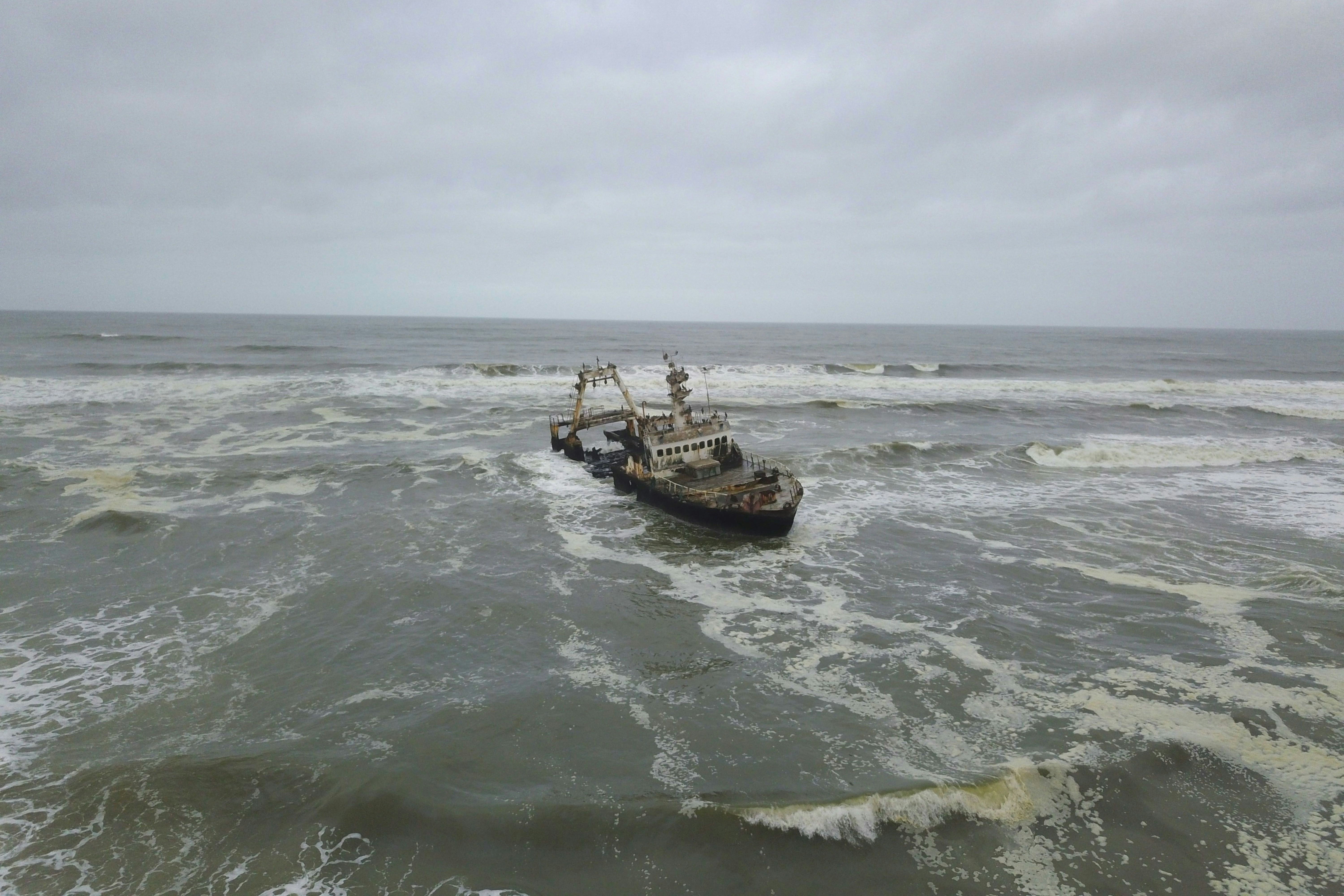 A boat in the middle of a body of water