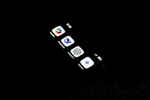 A cell phone that is lit up in the dark