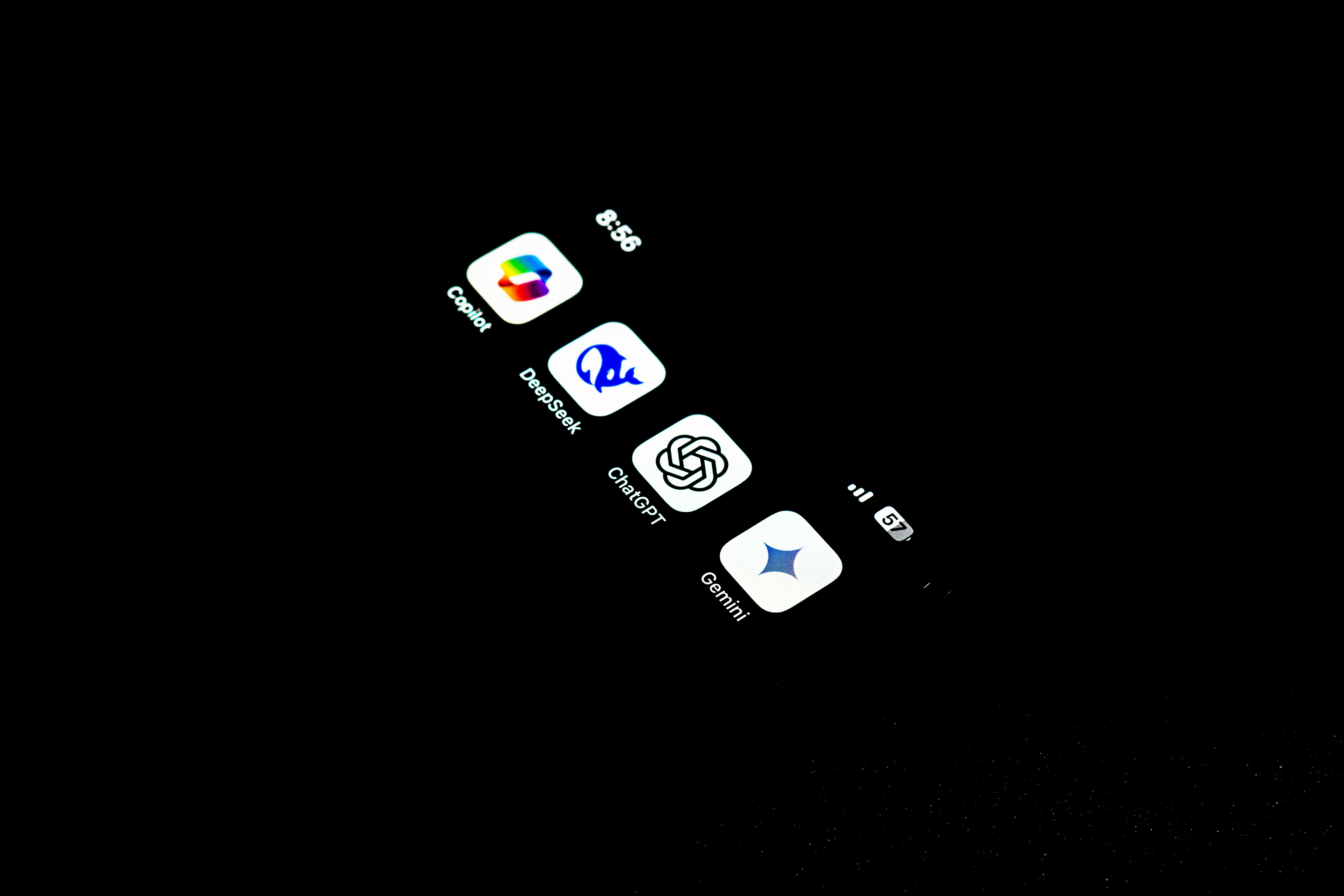 A cell phone that is lit up in the dark