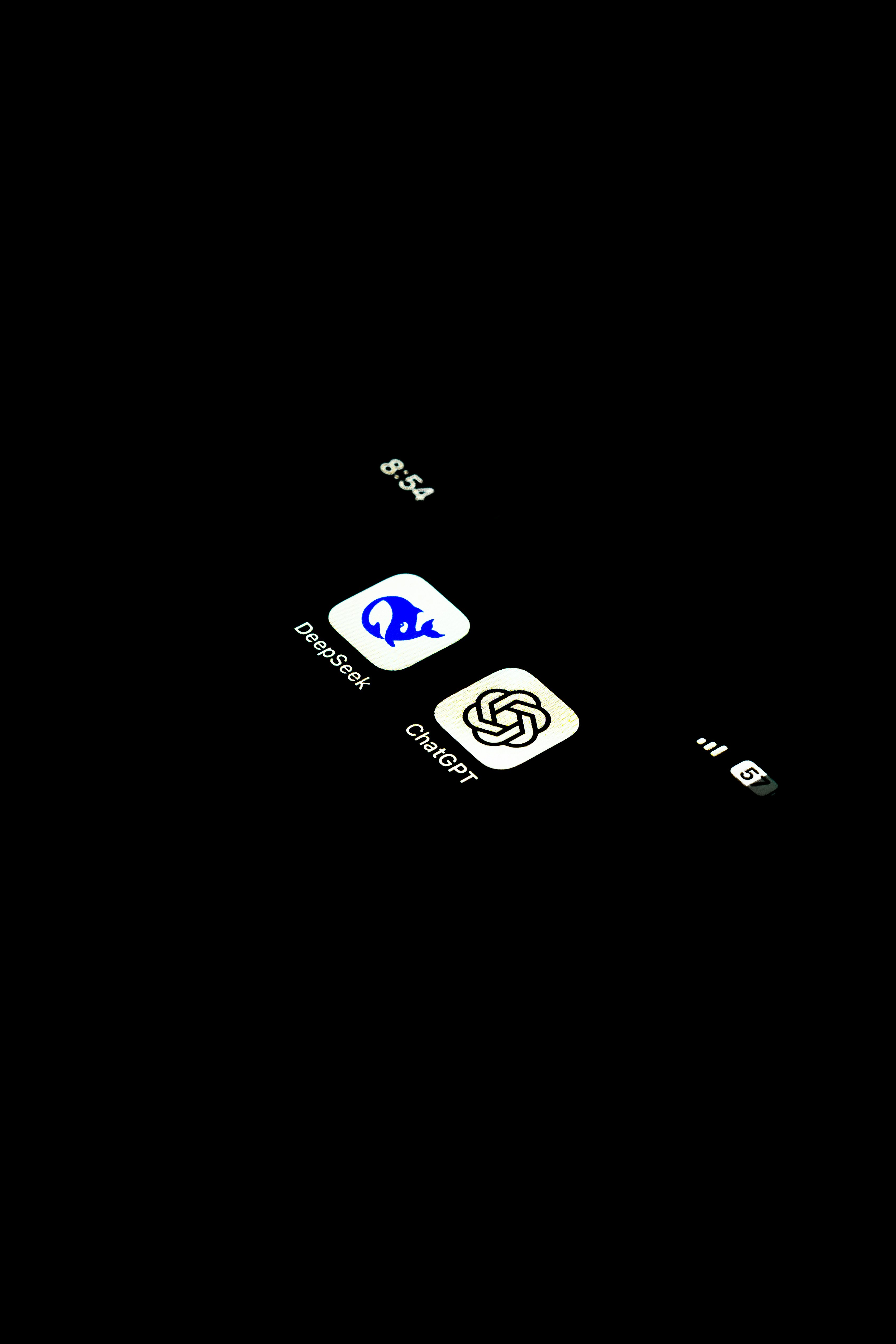 A cell phone is shown in the dark