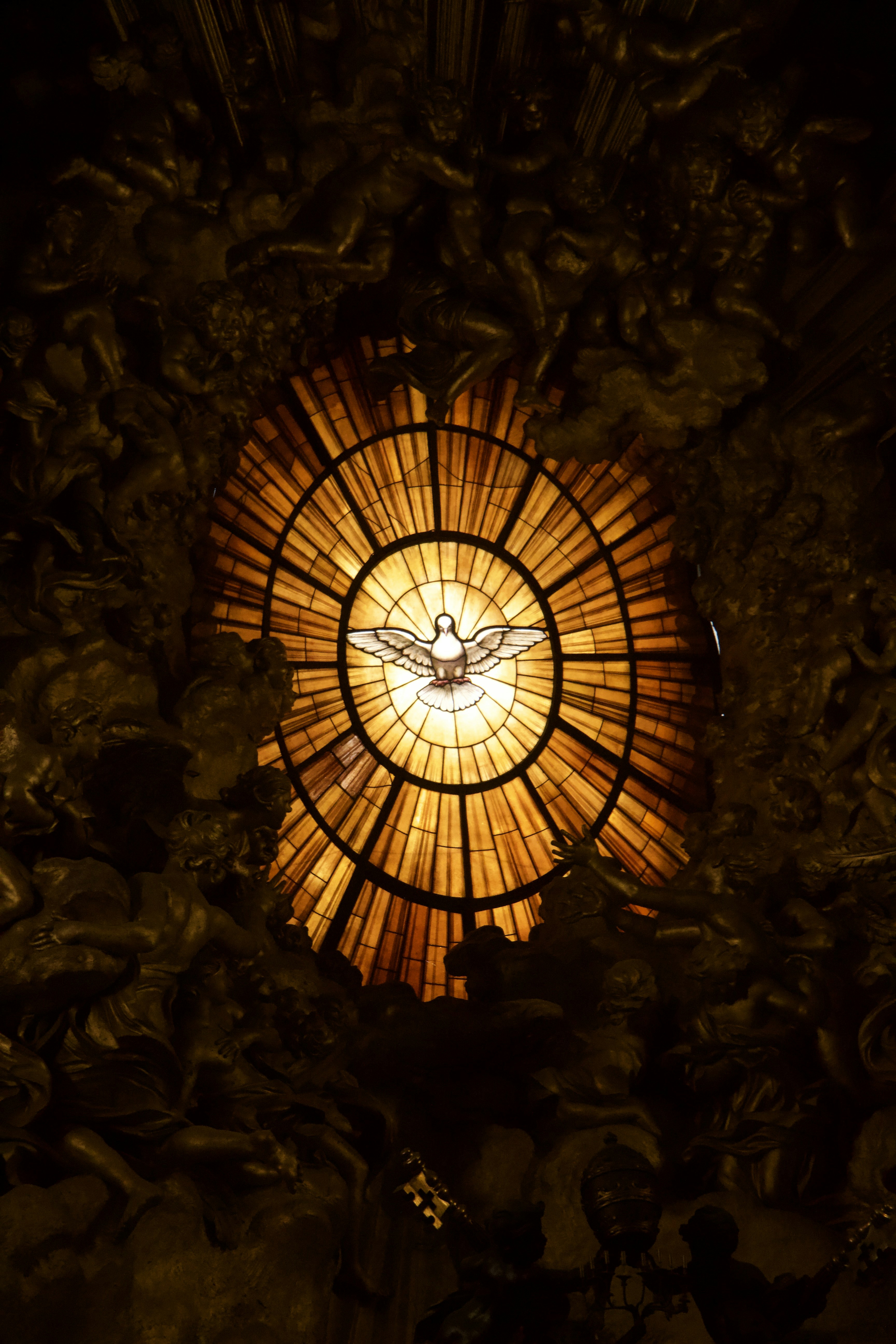 A stained glass window in the ceiling of a building