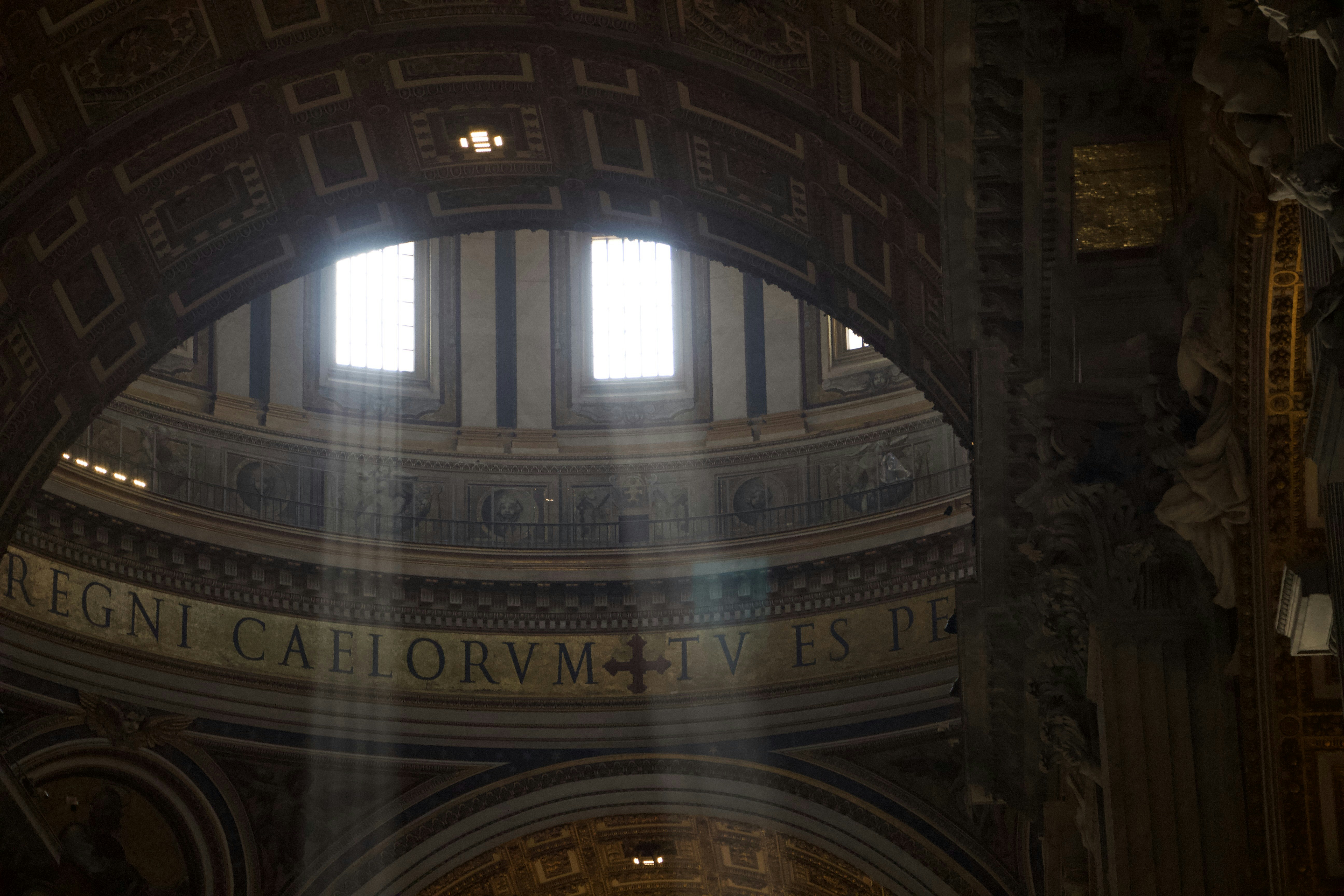 The sun shines through a window in a building